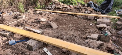 Clearance started.<br />Most of the large chunks removed, but one (near the north wall) remains in place and results in a decision on where the ground can be levelled to.